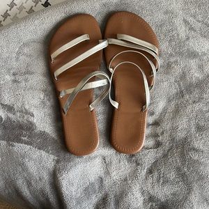 Silver strappy flip flops